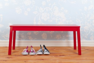 Hall with blue vintage wall paper red bench on and wooden floor and shoes