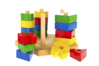 Colorful wooden baby toys isolated over white