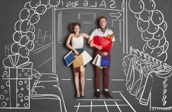 Love story concept of romantic couple on shopping against chalk drawings background. Young couple