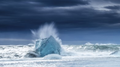 Diamond Beach, iceberg in the surf, near Jökulsarlon glacier lagoon, Vatnajökull National Park,