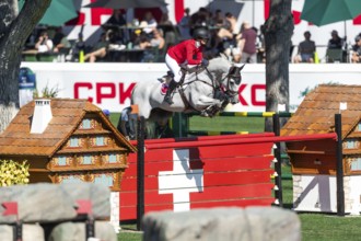 Geraldine Straumann of Switzerland, riding Long John Silver 3 compete in the BMO Nations Cup during