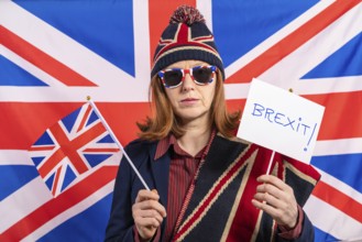 British redhead woman with UK flag and Brexit banner
