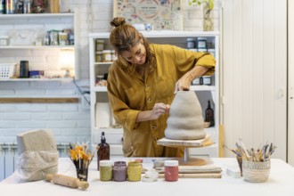 Talented ceramist crafting unique pieces in her studio