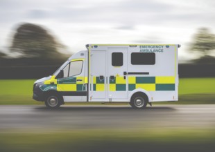 A United Kingdom Ambulance Rushing To An Emergency In The Countryside