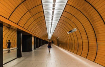 Munich, Bavaria, Germany, 07 29 2018: Young woman in summer skirt walking through a pedestrian