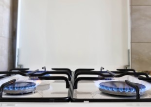 Energy efficiency concept with gas cooker – the cost of natural gas is more expensive. Close up,