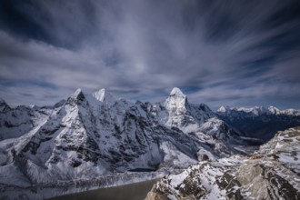 Ama Dablam and other Mountains and Dramatic Sky. Nepal, Himalaya