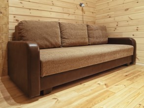 Single sofa in the log house bedroom