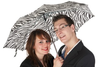 Young couple together under the black and white umbrella