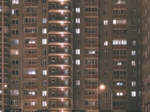 Night view of exterior apartment building. High rise apartments in night light