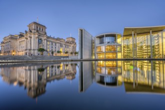 The Reichstag and part of the Paul Löbe House on the Spree in Berlin at dusk
