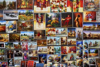 Wall full of oil paintings