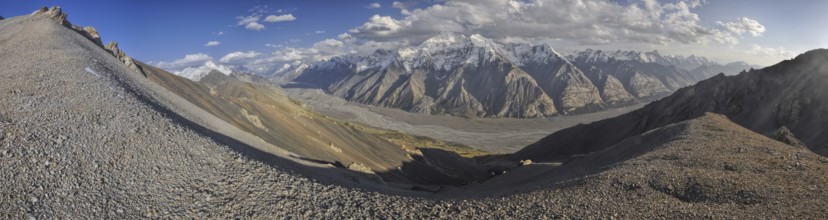 Scenic panorama of valley and mountain peaks in Tien-Shan mountain range in Kyrgyzstan