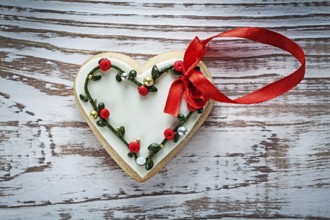 Heart-shaped Christmas gingerbread on an old wooden board