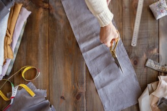 Person cutting fabric sewing