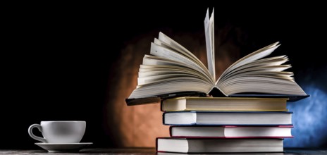 A composition with books and a cup of coffee