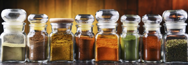 Glass storage jars with spices and herbs