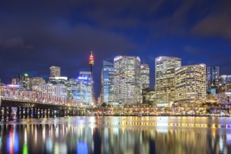 Sydney skyline and Pyrmont bridge at dusk near Darling Harbour, in Sydney Australia