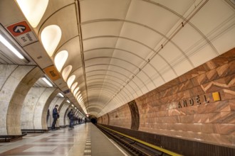 Prague, Czech Republic, March 20, 2017: People waiting for the subway at Andel metro station,