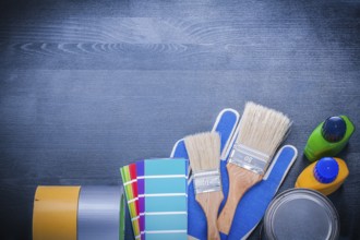 Set of painting tools on wooden board construction concept