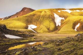 Magic sunrise in the Arctic. The golden light of dawn illuminates the mountains and glaciers