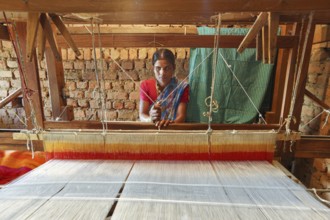 Woman weaving clothes on handloom, bastar, chhattisgarh, india, asia