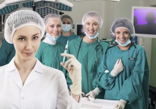 Young female anesthetist with syringe on the surgery teem background