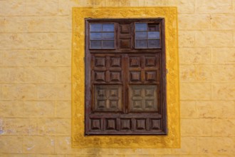 La Orotava wooden window in yellow wall Tenerife at Canary Islands