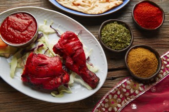 Chicken Tandoori indian recipe with spices on wood