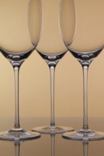 Three empty glasses of wine on a clean background