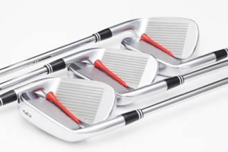 Titanium golf clubs on the white background