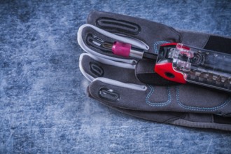 Muunction toolbox staff safety gloves on metallic background