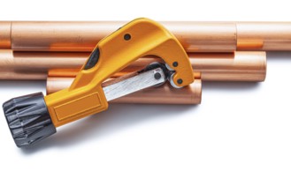 Pipecutter And Copper Pipe Isolated On White