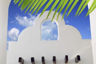 Mexican architecture white archs blue sky in Mayan Riviera