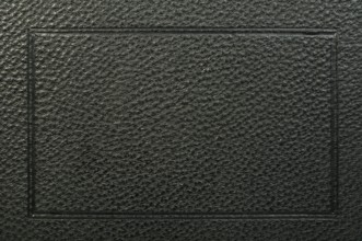 Old vintage black leather background. Studio shot