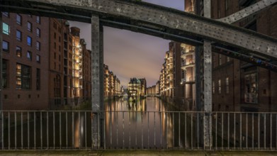 The moated castle in the Speicherstadt photographed from the Poggemühlen Bridge