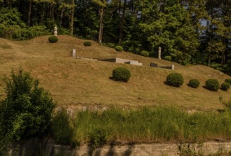 Daejeon, South Korea, May 26, 2019: Marked burial mounds in family graveyard located on forested