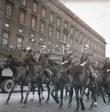 1940s soldiers on horses. In the street with the royal castle in Stockholm in the background,