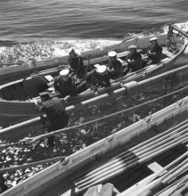 During World war II. The war ship Sverige during navy exercises at sea. The life boat is being
