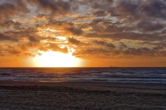 Sunset at the North Sea beach of Denmark with beautiful light on a summer day. Sunset at the North