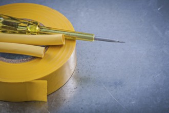Yellow insulating tape electric cables insulated turnscrew construction concept