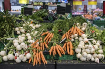 Carrots and onions in supermarket