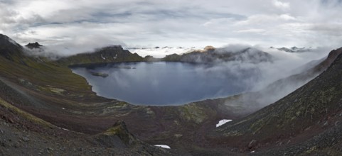 Scenery panorama landscape of Kamchatka Peninsula: view of beautiful mountain lake in crater active