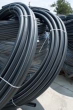 Coiled black PVC hoses. Polyethylene tubing