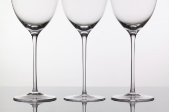 Three empty glasses of wine on a clean background
