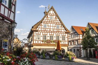 Neubulach, Baden-Württemberg, Germany, Charming half-timbered old town with lush floral decorations