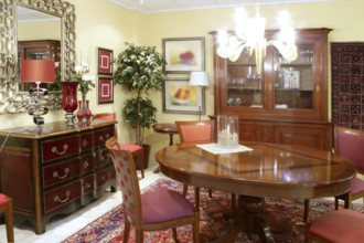 Classic living room table warm wood furniture glowing chandelier