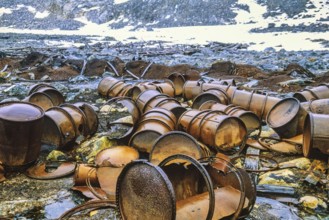 Rusty barrels after polar expeditions on Svalbard
