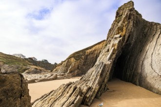 Adorable sea gull. Incredible rock formations, stones and boulders. Cantabria, Spain. The Playa de