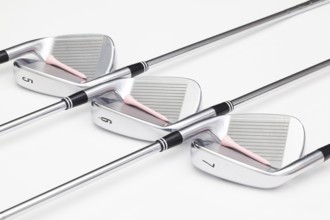 Titanium golf clubs on the white background